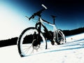 Extremme contrast. Mountain bike stay in powder snow. Lost path in deep snowdrift. Royalty Free Stock Photo