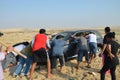 Extricating vehicle stuck in the sand