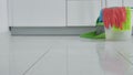 Extrim close up woman washing white kitchen floor with special swob, cleaning service, close-up 4k