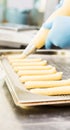 Extruded through a nozzle pastry choux pastry, cake forms