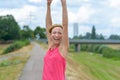 Exuberant vivacious woman celebrating outdoors Royalty Free Stock Photo