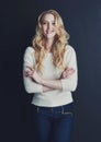 She exudes a sense of confidence. Studio portrait of a smiling young woman isolated on black. Royalty Free Stock Photo