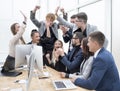 exultant business team looking at the screen of the office computer Royalty Free Stock Photo