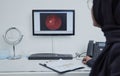 Eye analysis, optometry and a doctor with a computer for research on a retina and lens problem. Ophthalmology
