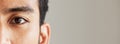 Eye banner, portrait and man for optometry, vision and mockup for healthcare advertising. Half face, closeup and person
