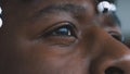 Eye of a black man close up. Tears in fearful african american black man