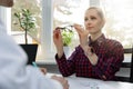 Eye care - woman testing her new eyeglasses in optometrist office Royalty Free Stock Photo