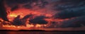 Red colored cumulonimbus cloud, sunset seascape. Royalty Free Stock Photo