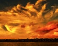 Orange colored stratocumulus cloud, sunset seascape. Royalty Free Stock Photo