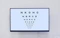Eye chart, television and screen in hospital for optometry examination, vision and wellness. Healthcare, eyecare tv and