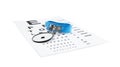 Eye chart test and head mirror on white. Ophthalmologist tools