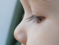 Eye of the child looking at window, closeup macro shoot. Royalty Free Stock Photo