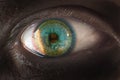 Eye close-up with bitcoin reflection