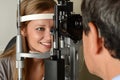 Eye Doctor examinating a young patient