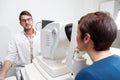 Eye Doctor is measuring a patient`s visual field Royalty Free Stock Photo