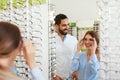 Eye Doctor With Woman Choosing Eyeglasses At Glasses Store Royalty Free Stock Photo