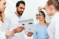 Eye Exam. Doctors Checking Woman Eyesight With Optometry Glasses Royalty Free Stock Photo