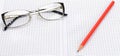 Eye glasses, blank notepad and pen on a white. Wide photo Royalty Free Stock Photo