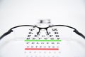 Eye glasses on eyesight test chart. Royalty Free Stock Photo