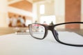 Eye glasses placed on a blank paper