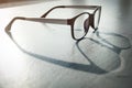 Eye Glasses with sunlight and shadow on rough floor