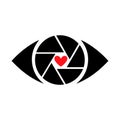 An eye with a heart-shaped pupil. The eye is a photo lens with a shutter Royalty Free Stock Photo