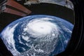 Eye of the hurricane. Typhoon over the planet Earth, view through the porthole of the space station. A category 5 super Typhoon