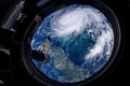 Eye of the hurricane. Typhoon over the planet Earth, view through the porthole of the space station. A category 5 super Typhoon
