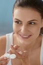 Eye lens. Smiling woman with contact eye lenses and container Royalty Free Stock Photo