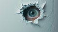 An eye looking through a torn hole in paper or wall. Royalty Free Stock Photo