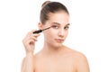 Eye make up apply. Mascara applying closeup, long lashes. makeup brush. Isolated. Royalty Free Stock Photo