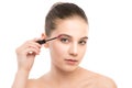 Eye make up apply. Mascara applying closeup, long lashes. makeup brush. Isolated. Royalty Free Stock Photo