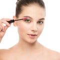 Eye make up apply. Mascara applying closeup, long lashes. makeup brush. Isolated. Royalty Free Stock Photo