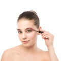 Eye make up apply. Mascara applying closeup, long lashes. makeup brush. Isolated. Royalty Free Stock Photo