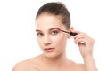 Eye make up apply. Mascara applying closeup, long lashes. makeup brush. Isolated. Royalty Free Stock Photo