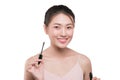 Eye make up apply. Mascara brush. Portrait of beautiful asian w Royalty Free Stock Photo