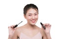 Eye make up apply. Mascara brush. Portrait of beautiful asian w Royalty Free Stock Photo