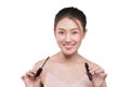 Eye make up apply. Mascara brush. Portrait of beautiful asian w Royalty Free Stock Photo