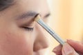 Eye makeup with brush on pretty woman Royalty Free Stock Photo