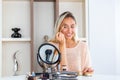 Eye makeup woman applying eyeshadow powder. Young beautiful woman making make-up near mirror,sitting at the desk Royalty Free Stock Photo