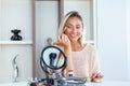 Eye makeup woman applying eyeshadow powder. Young beautiful woman making make-up near mirror,sitting at the desk Royalty Free Stock Photo