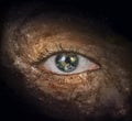 Eye in midst of Galaxy with Earth Reflection Royalty Free Stock Photo