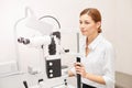 Eye ophthalmologist exam. Eyesight recovery. Astigmatism check concept. Ophthalmology diagmostic device. Beauty girl portrait in Royalty Free Stock Photo