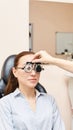 Eye ophthalmologist exam. Eyesight recovery. Astigmatism check concept. Ophthalmology diagmostic device. Beauty girl portrait in Royalty Free Stock Photo