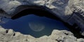 The eye of rock with moon reflection Royalty Free Stock Photo