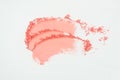 Pink eye shadow or pink bronzer smudge on white background Royalty Free Stock Photo