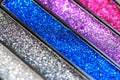 Eye shadow palette. Shiny silver, blue, pink sparkling glitter in eyeshadow set. Royalty Free Stock Photo