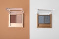 Eye shadow palettes on colorful background, flat lay