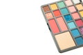Eye shadows in different colors for fashionable professional trendy makeup. Shadow palette isolated on white background