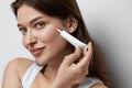 Eye Skin Care. Beautiful Woman Applying Eye Cream Royalty Free Stock Photo